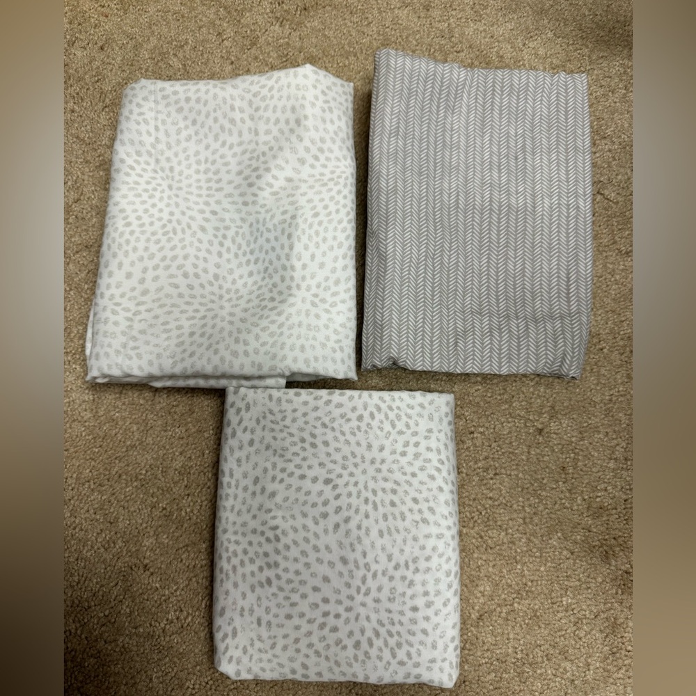 Set of 3 HALO bassinet fitted sheets. One of them has a stain.